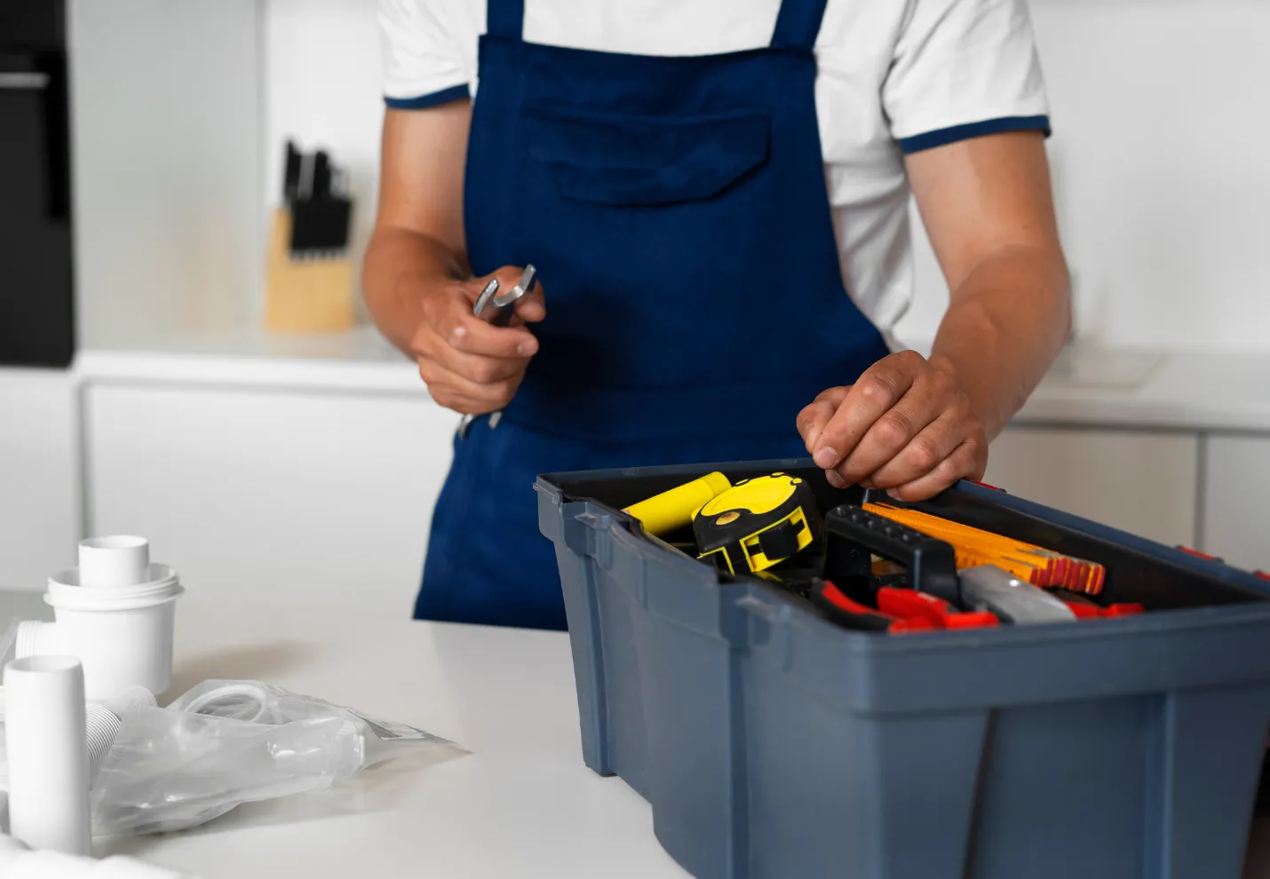 Professional handyman preparing tools for home repair and maintenance service inside Dallas home