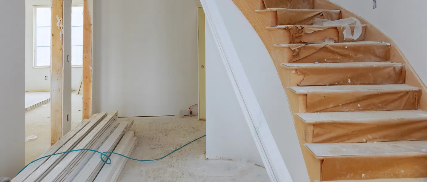 Renovated home exterior with new siding, windows, and upgraded front entrance