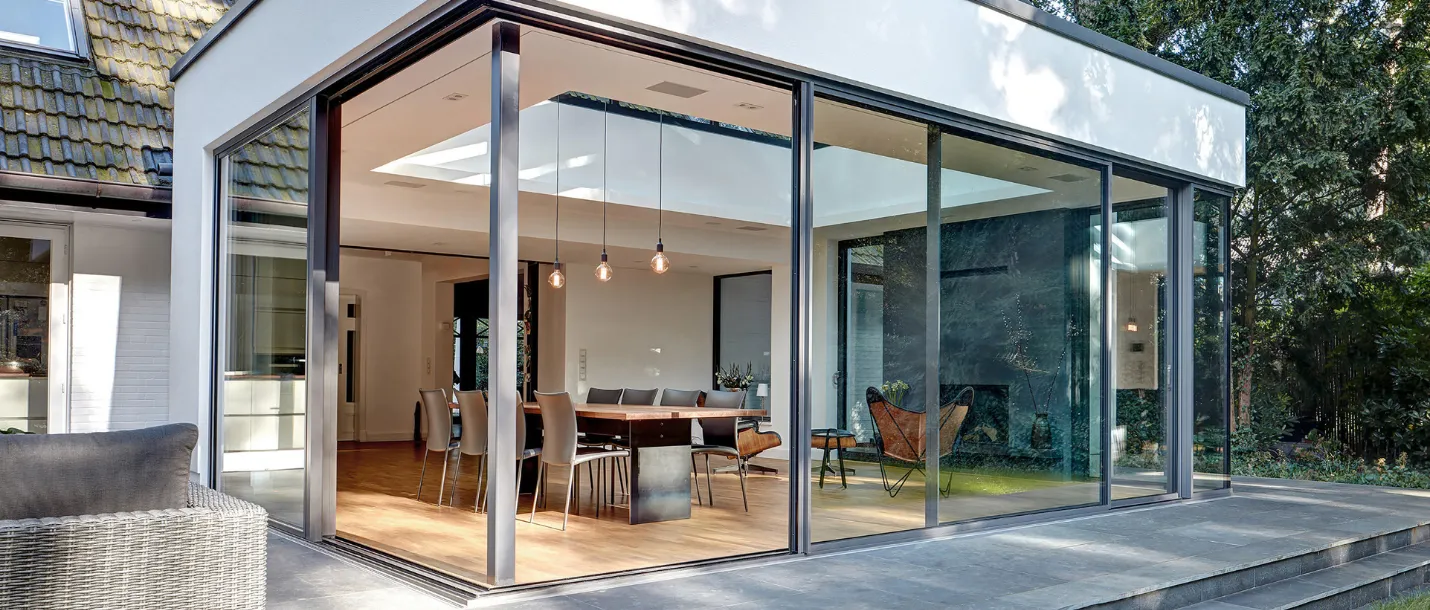Home addition under construction with new structural framing and roof layout